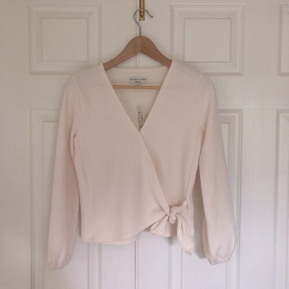 Cream colored,Madewell,wrap top with long sleeves.